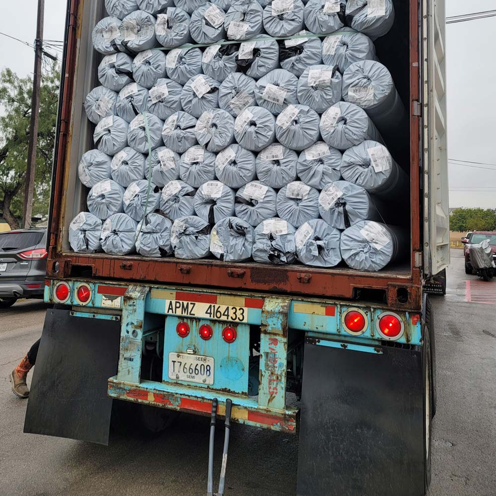 truck receiving rolls of geo-textiles